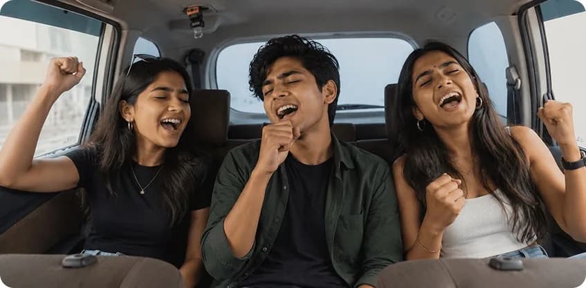 Friends singing together in the back seat on a road trip