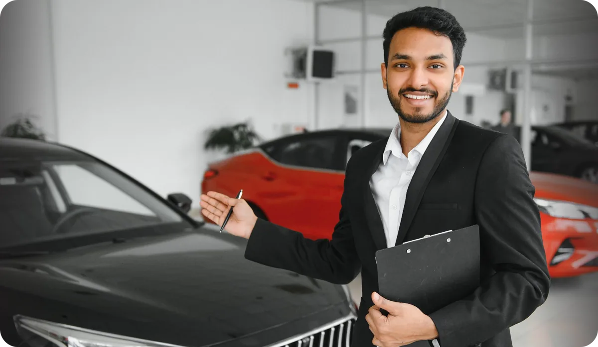 Bharat Self Drive team member at a car showroom