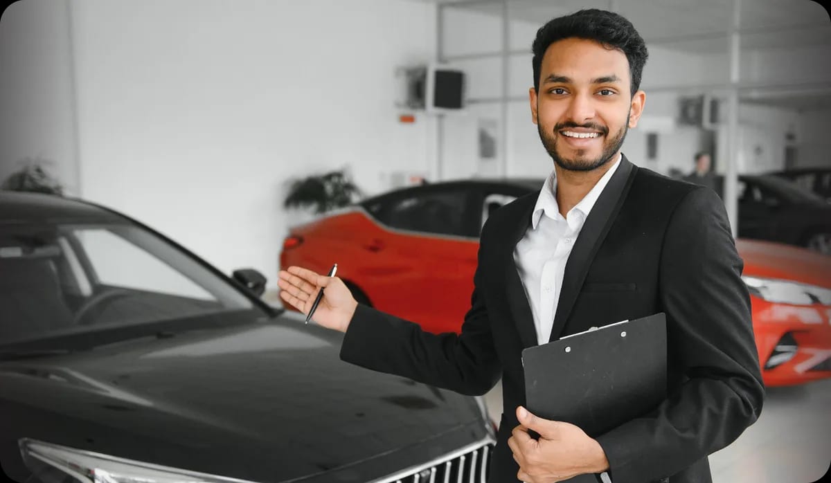 Bharat Self Drive team member at a car showroom